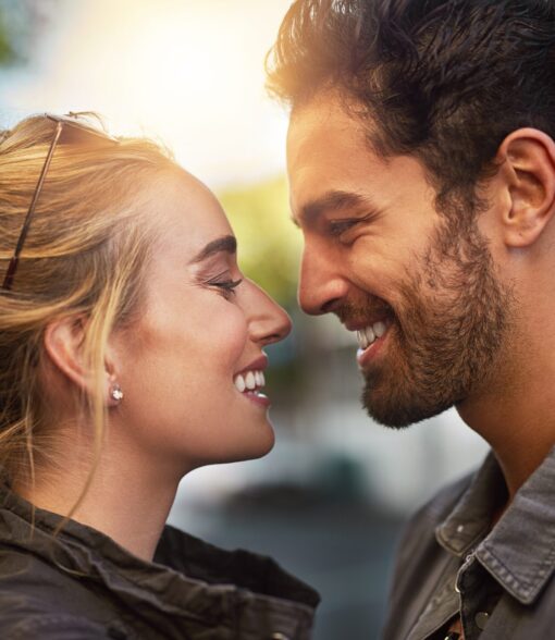 Couple,,Eye,Contact,And,Smile,In,Profile,,Outdoor,And,Bonding